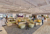 Spacestor Modular Zoning Wooden Bleacher System with Green Coffee Table and Stool in Restaurant Setting