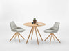 Stiks Wooden Top Round Coffee Table With Chairs In Studio Setting