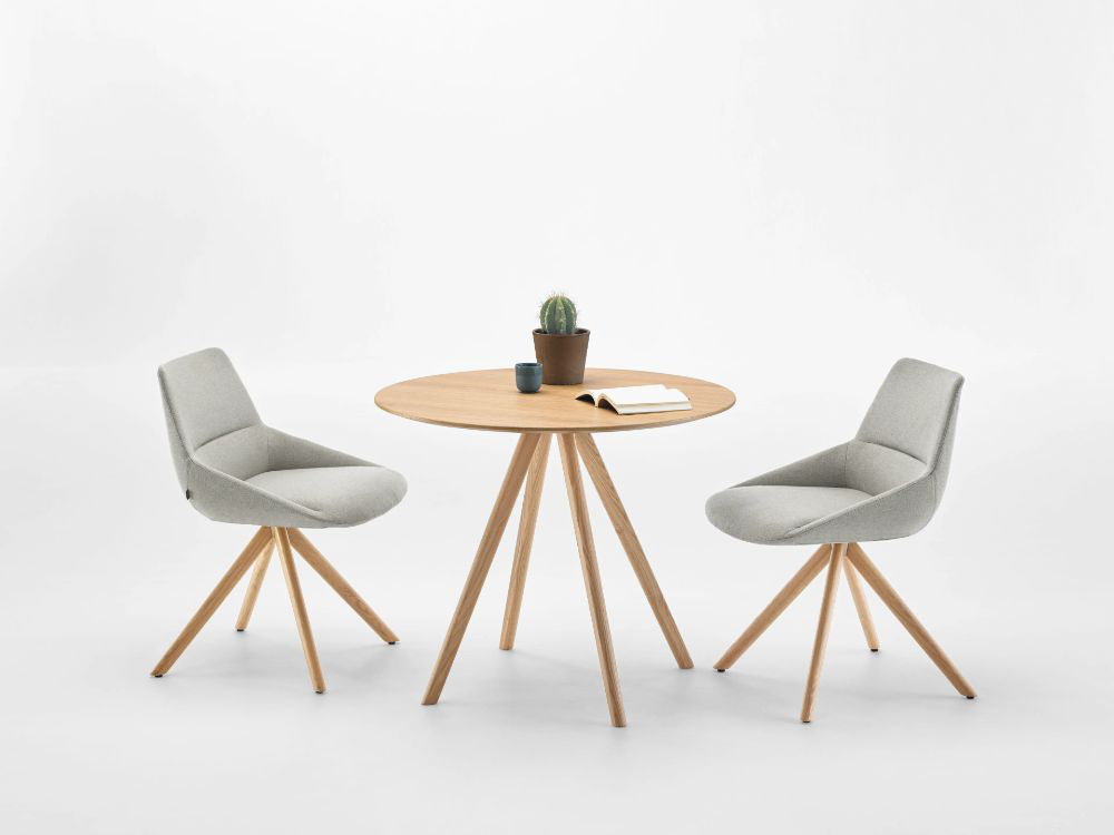 Stiks Wooden Top Round Coffee Table With Chairs In Studio Setting