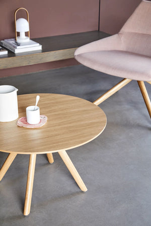 Stiks Wooden Top Round Coffee With Chair In Living Room Setting