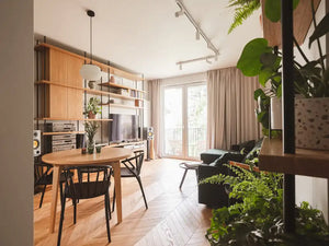 Sudoku Wooden Dining Chair in Black Finish with Round Table and Sofa in Living Room Setting