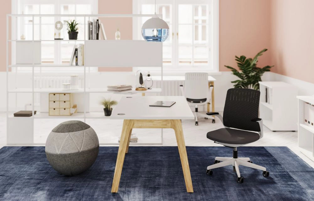 Switch Design Single Bench Desk with Black Task Chair and Round Pouffe in Modern Office Setting