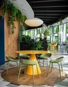Team Polypropylene Ergonomic Low Stool with Round Canteen Table and High Stool in Canteen Setting