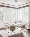Ultra Office Chair on 4 Legged Metal Legs with Mobile Table and Bookshelf in Modern Office Setting
