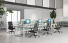 X44 Mesh Back Operator Chair with S Shape Backrest with White Sit Stand Bench Desk with Desk Screen in Modern Office Setting